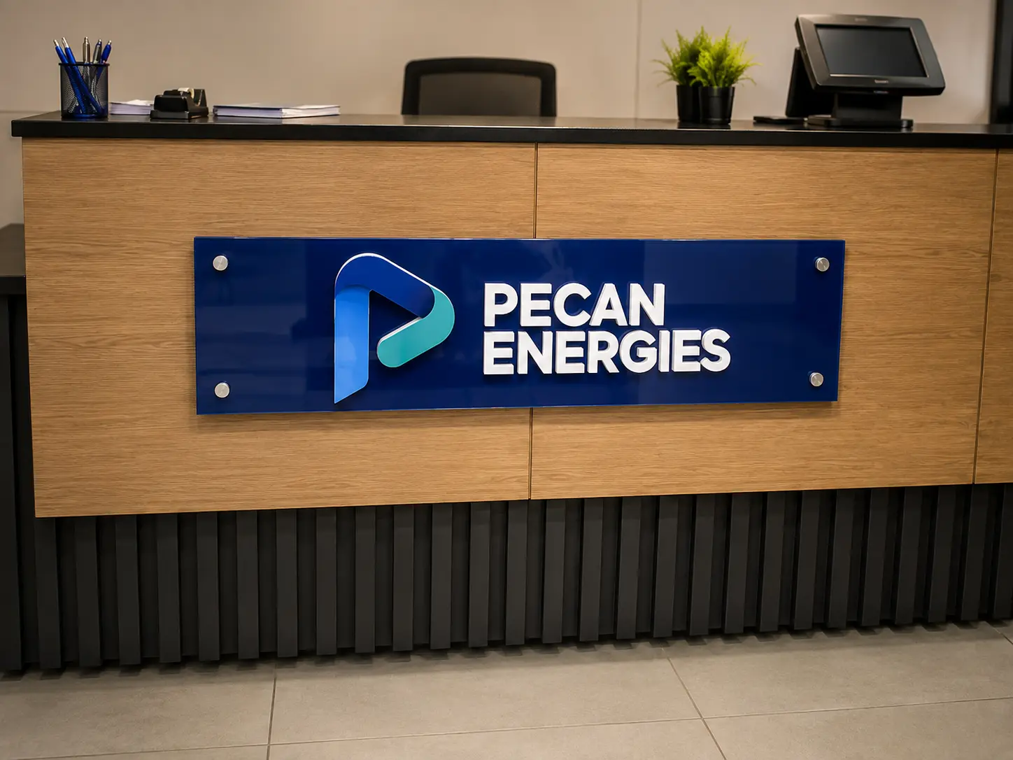 Interior branding and signage in a corporate reception area